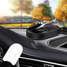 لوحة شمسية على موزع العطر للسيارة